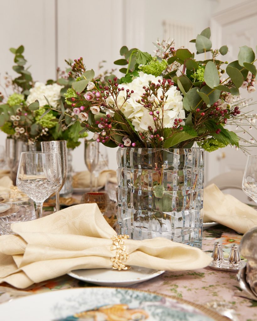 Contemporary dinner with flowers in a glass jar and napkins near the flowers