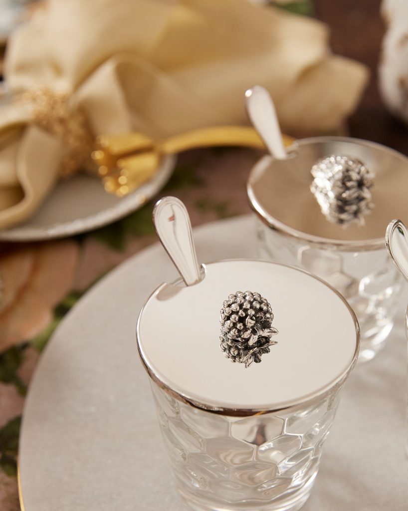 glass with sealed top and a spoon inside the glass